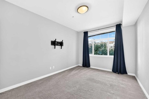 202-10 Auburn Bay Link Se, Calgary, AB - Indoor Photo Showing Other Room