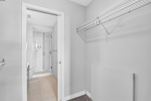 202-10 Auburn Bay Link Se, Calgary, AB - Indoor With Storage