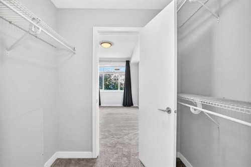 202-10 Auburn Bay Link Se, Calgary, AB - Indoor With Storage