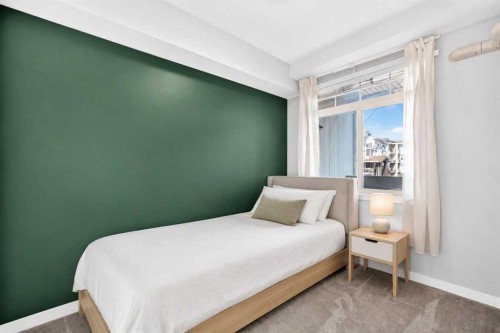 202-10 Auburn Bay Link Se, Calgary, AB - Indoor Photo Showing Bedroom