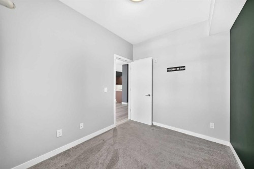 202-10 Auburn Bay Link Se, Calgary, AB - Indoor Photo Showing Other Room