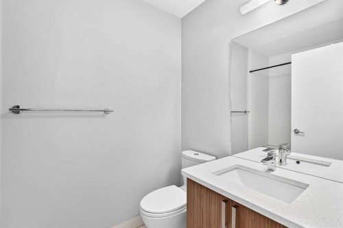 202-10 Auburn Bay Link Se, Calgary, AB - Indoor Photo Showing Bathroom