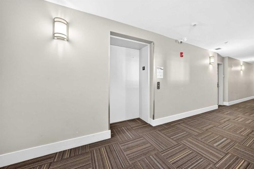 202-10 Auburn Bay Link Se, Calgary, AB - Indoor Photo Showing Other Room