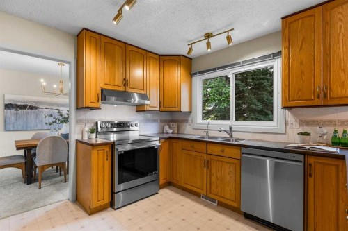 92 Canova Road Sw, Calgary, AB - Indoor Photo Showing Kitchen With Double Sink