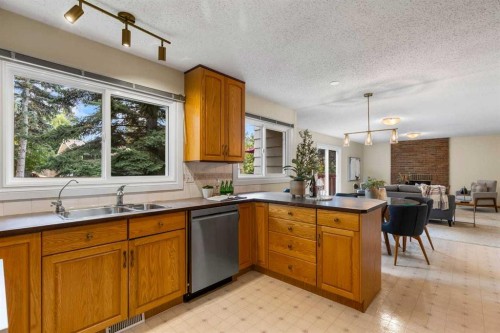 92 Canova Road Sw, Calgary, AB - Indoor Photo Showing Kitchen With Double Sink