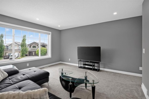 32 Legacy Cove Se, Calgary, AB - Indoor Photo Showing Living Room