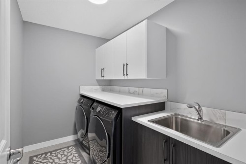 32 Legacy Cove Se, Calgary, AB - Indoor Photo Showing Laundry Room