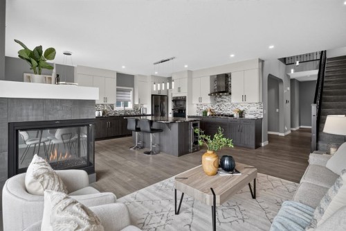 32 Legacy Cove Se, Calgary, AB - Indoor Photo Showing Living Room With Fireplace