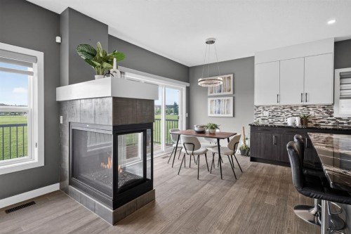 32 Legacy Cove Se, Calgary, AB - Indoor Photo Showing Other Room With Fireplace