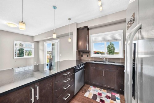 2401-175 Panatella Hill Nw, Calgary, AB - Indoor Photo Showing Kitchen With Upgraded Kitchen