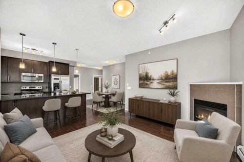 2401-175 Panatella Hill Nw, Calgary, AB - Indoor Photo Showing Living Room With Fireplace