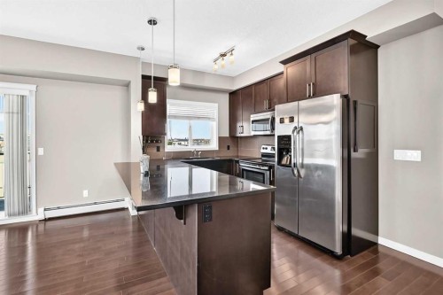 2401-175 Panatella Hill Nw, Calgary, AB - Indoor Photo Showing Kitchen With Stainless Steel Kitchen With Upgraded Kitchen