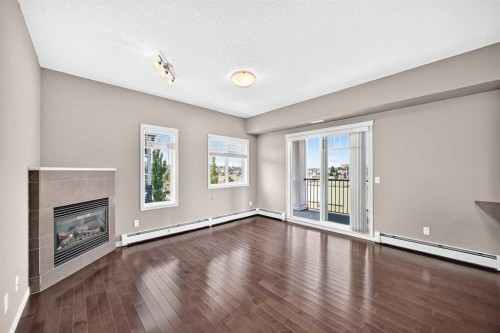 2401-175 Panatella Hill Nw, Calgary, AB - Indoor With Fireplace