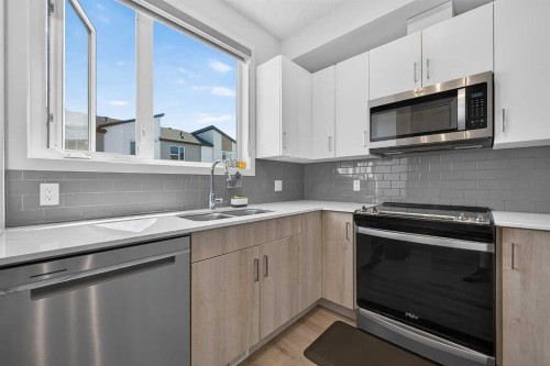 433-301 Redstone Boulevard Ne, Calgary, AB - Indoor Photo Showing Kitchen With Stainless Steel Kitchen With Double Sink With Upgraded Kitchen