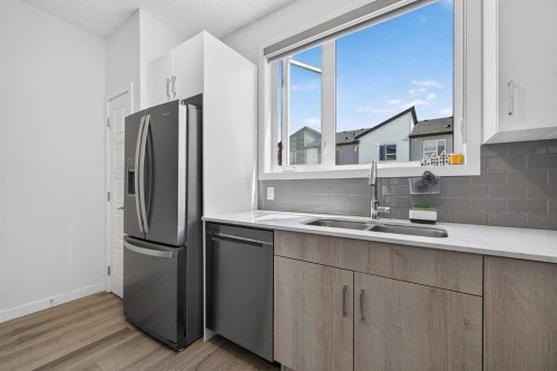 433-301 Redstone Boulevard Ne, Calgary, AB - Indoor Photo Showing Kitchen With Stainless Steel Kitchen With Double Sink