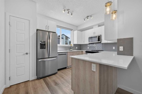 433-301 Redstone Boulevard Ne, Calgary, AB - Indoor Photo Showing Kitchen With Stainless Steel Kitchen With Upgraded Kitchen