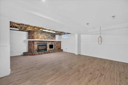 235 Abalone Place Ne, Calgary, AB - Indoor With Fireplace
