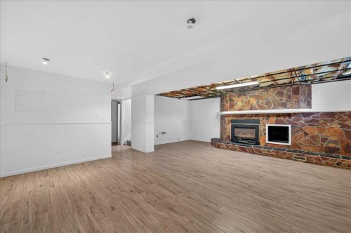 235 Abalone Place Ne, Calgary, AB - Indoor With Fireplace