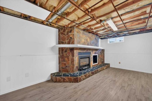 235 Abalone Place Ne, Calgary, AB - Indoor With Fireplace