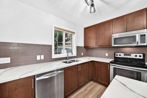 86 Pantego Lane Nw, Calgary, AB - Indoor Photo Showing Kitchen With Double Sink