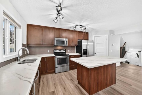86 Pantego Lane Nw, Calgary, AB - Indoor Photo Showing Kitchen With Double Sink