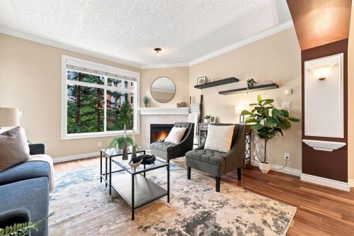 209-59 22 Avenue Sw, Calgary, AB - Indoor Photo Showing Living Room With Fireplace