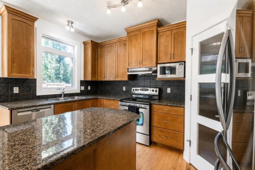 108 Tuscany Estates Close Nw, Calgary, AB - Indoor Photo Showing Kitchen With Double Sink
