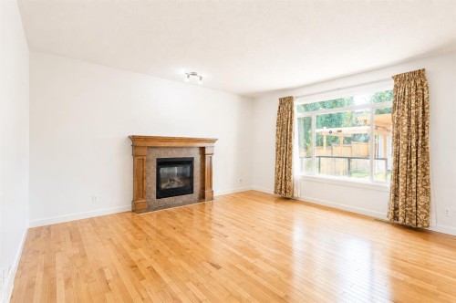 108 Tuscany Estates Close Nw, Calgary, AB - Indoor Photo Showing Living Room With Fireplace