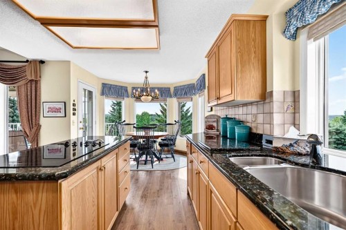 36 Sunset Way, Priddis Greens, AB - Indoor Photo Showing Kitchen With Double Sink
