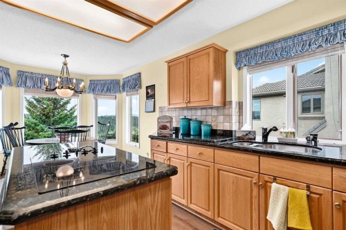 36 Sunset Way, Priddis Greens, AB - Indoor Photo Showing Kitchen With Double Sink