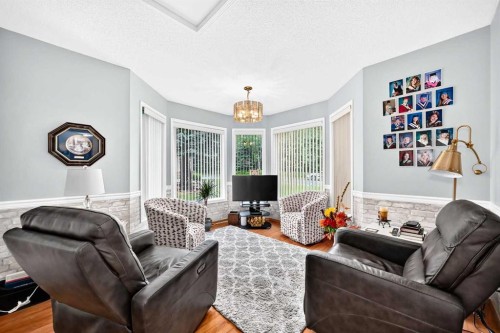 36 Sunset Way, Priddis Greens, AB - Indoor Photo Showing Living Room