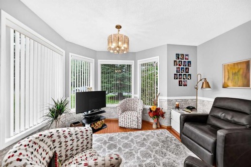 36 Sunset Way, Priddis Greens, AB - Indoor Photo Showing Living Room