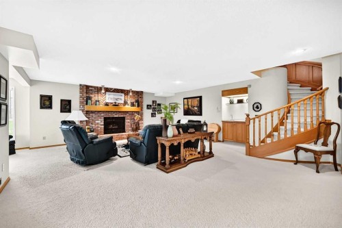 36 Sunset Way, Priddis Greens, AB - Indoor With Fireplace