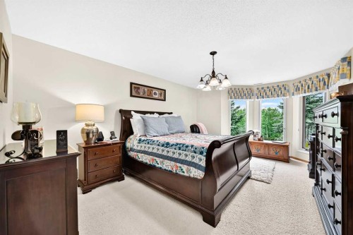 36 Sunset Way, Priddis Greens, AB - Indoor Photo Showing Bedroom