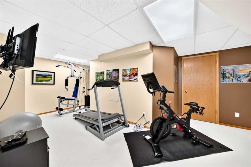 36 Sunset Way, Priddis Greens, AB - Indoor Photo Showing Gym Room