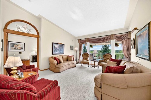 36 Sunset Way, Priddis Greens, AB - Indoor Photo Showing Living Room