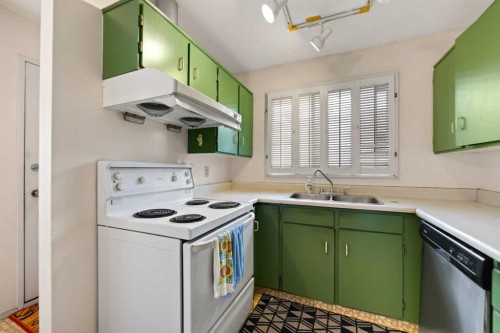 224 Berwick Way Nw, Calgary, AB - Indoor Photo Showing Kitchen With Double Sink