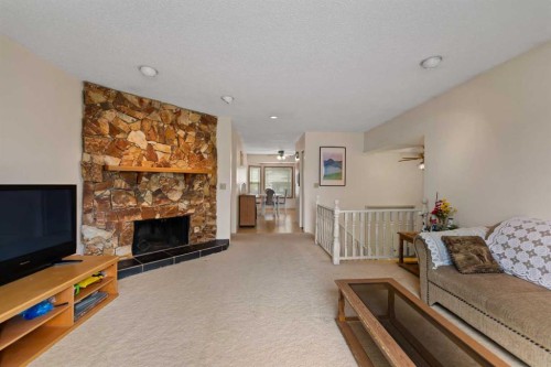 224 Berwick Way Nw, Calgary, AB - Indoor Photo Showing Living Room With Fireplace