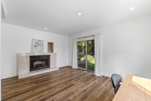 2801 7 Avenue Nw, Calgary, AB - Indoor Photo Showing Other Room With Fireplace