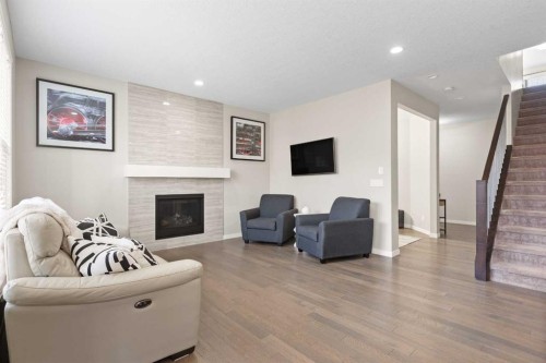 39 Brightoncrest Point Se, Calgary, AB - Indoor Photo Showing Living Room With Fireplace