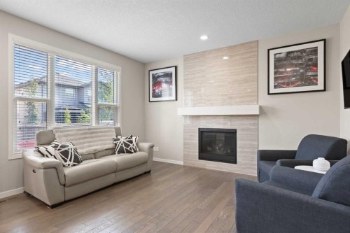 39 Brightoncrest Point Se, Calgary, AB - Indoor Photo Showing Living Room With Fireplace