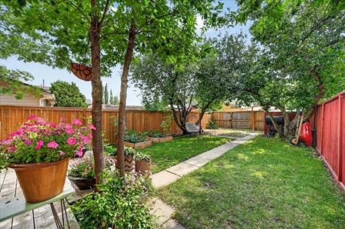 57 Beacham Way Nw, Calgary, AB - Outdoor With Backyard