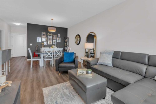 101-30 Shawnee Common Sw, Calgary, AB - Indoor Photo Showing Living Room
