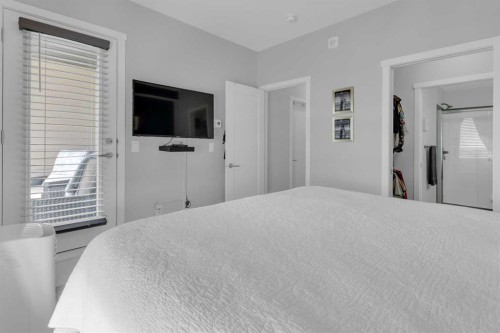 101-30 Shawnee Common Sw, Calgary, AB - Indoor Photo Showing Bedroom