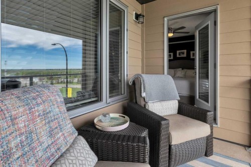 101-30 Shawnee Common Sw, Calgary, AB - Outdoor With Deck Patio Veranda With Exterior