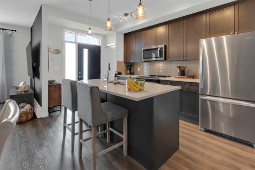 101-30 Shawnee Common Sw, Calgary, AB - Indoor Photo Showing Kitchen With Stainless Steel Kitchen With Upgraded Kitchen
