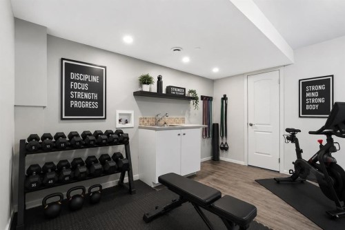 21 Howse Street Ne, Calgary, AB - Indoor Photo Showing Gym Room