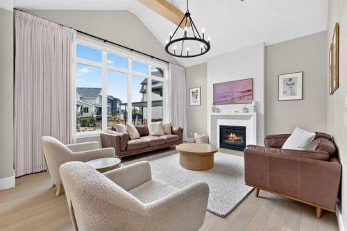 147 Marina Landing Se, Calgary, AB - Indoor Photo Showing Living Room With Fireplace