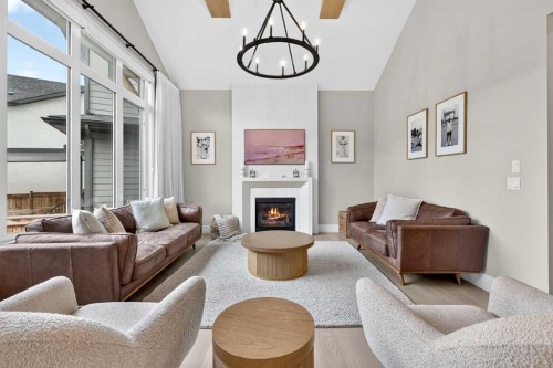 147 Marina Landing Se, Calgary, AB - Indoor Photo Showing Living Room With Fireplace