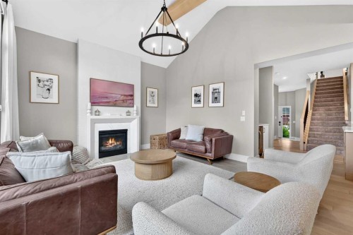 147 Marina Landing Se, Calgary, AB - Indoor Photo Showing Living Room With Fireplace